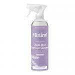 A photo shows six 750ml Miniml Anti-Bac Surface Cleaner bottles arranged in two rows of three on a white background. Each clear bottle contains pale lavender liquid, sports a simple white label with minimalist logo and lavender illustration, and features a white trigger spray cap. Soft shadows show.