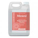 Two matte white 5-liter jugs of Miniml multi-surface cleaner stand side by side against a pale background. Each jug bears a minimalist orange label with a stylized blood-orange illustration, crisp black type, molded handle and ribbed screw cap.
