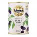 Photo shows six upright Biona Organic bags of black beans, each marked 400g. The packs have white and green branding, large 'Black Beans' text and organic logo. A small clear window reveals shiny black beans; bags stand against a plain light background.