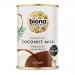 A shrink-wrapped six-pack of 400ml Biona Organic coconut milk cartons sits on a plain surface. Each white carton shows the green Biona logo, an illustrated halved coconut and leafy accents. The pack appears neat, compact and uniformly aligned in two rows of three. Matte surface small icons on sides.