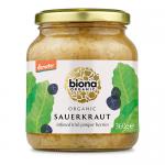 Several clear glass jars of Biona Organic Demeter sauerkraut, each labeled 360 g, stand in a neat row on a neutral surface. Pale shredded cabbage shows through the glass. White labels display the green Biona logo, Demeter and organic certification marks, with green lids and simple lighting. Softly.
