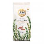 A brown kraft-style bag with a clear window reveals short, ridged spelt penne in warm golden-brown tones. The label displays Biona Organic and Spelt Wholegrain Penne in simple green and white typography, along with an organic emblem and the product weight. The bag has a matte finish; tiny wheat mark