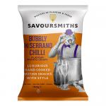A glossy bag of Savoursmiths Bubbly & Serrano Chilli crisps sits on a neutral surface. The packet shows airy, bubbled potato crisps spilling out beside a vivid illustration of red Serrano chillies. Bold logo and spicy-red accents contrast with pale, warm background tones. Soft sheen highlights edges