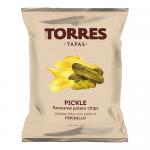 Seventeen green-and-yellow 125g Torres Pickle Flavour crisps bags are arranged in neat rows inside a shallow cardboard tray. Each glossy bag shows the Torres logo, pickle imagery and crisp illustrations, with nutritional text visible on some backs.