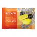 A compact box of 15 individually wrapped coco bites sits open, revealing neat rows of 9g mango & passion fruit morsels. Bright yellow and orange artwork shows sliced mango and passionfruit, while a single unwrapped bite exposes a glossy coconut fondant center and shredded coconut coating. dry crumbs