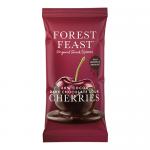 A countertop display of 12 Forest Feast bars, each in matte brown and burgundy wrappers showing dark chocolate squares and glossy sour cherries; packaging features images of mixed fruit, nuts and seeds, a bold brand logo and small icons.
