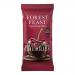 A countertop display of 12 Forest Feast bars, each in matte brown and burgundy wrappers showing dark chocolate squares and glossy sour cherries; packaging features images of mixed fruit, nuts and seeds, a bold brand logo and small icons.