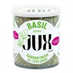 A neat pack of six compact JUX Food basil sachets sits in two rows. Each translucent pouch reveals dried green basil flakes and displays a green-and-white label with the JUX Food logo and product name. The plastic wrap gleams and small printed text lines the borders.