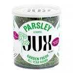 Photo shows six small JUX Food parsley packages (11 g each) that are arranged in two neat rows on a grocery shelf. Clear plastic reveals bright green dried parsley; white-green labels display the brand name and weight. Soft store lighting highlights their texture.