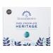 The image shows a 200g Summerdown Heritage Peppermint Fondants box beside eight round chocolate-coated fondants. Several are whole and a couple are sliced to reveal a bright white peppermint core. The packaging displays vintage lettering and mint-green accents.