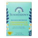 A rectangular box of Summerdown English Peppermint & Camomile tea appears in soft cream and pale green tones. The front shows delicate chamomile blossoms and peppermint leaves around elegant serif lettering. A small badge notes the net weight and an eight-count indication. It shows a soft matte texture.
