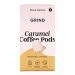 A photo shows a rectangular carton of Grind Coffee Roasters Caramel Blend beside ten home-compostable single-serve pods organized in two neat rows. The pack uses warm caramel-brown graphics with white logo text, compostable iconography and a visible 90g weight label.