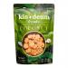 A cluster of twelve Kin + Deum Coconut Rice Chips 60 g bags sits against a white background. Each white-and-teal packet shows the Kin + Deum logo, coconut imagery and chip illustrations, with one open bag spilling pale, ridged rice crisps.
