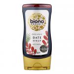 Six glass jars of Biona Organic Date Syrup (350g) are arranged in two neat rows, revealing dark amber syrup through clear glass. Each jar features a green-and-white Biona label with product text and a metallic lid, set against a clean, softly lit background.