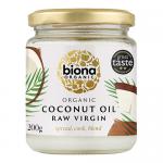 A set of six glass jars of Biona Organic Raw Virgin Coconut Oil sits on a neutral background. Each clear jar shows white solid coconut oil and carries a green-and-white label with the Biona logo, product name, organic certifications, and a screw-top lid. Lined up in two neat rows lit with soft light.