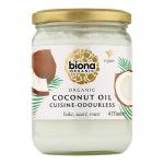 Six identical clear jars of pale coconut oil sit in a tidy cardboard tray. Each jar shows a white label with green Biona logo and product name, a simple coconut graphic, and a screw-top lid. The pack stands against a neutral studio background. Soft studio light casts mild highlights and soft shadows