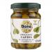 A clear glass jar with a green screw cap and a white Biona Organic label stands filled with small olive-green capers suspended in brine. Several identical jars are arranged together on a pale background, lit to show texture and glossy reflections.