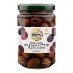 Five clear glass jars stand in formation, each filled with glossy pitted black olives submerged in pale brine. Green-and-white Biona labels wrap the jars beneath metal lids. Light glints on the olives and glass, revealing texture and dark purple-black tones. Nearby condensation dots mark the glass..