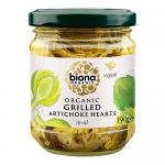 Five clear glass jars sit in a row, each filled with grilled artichoke halves suspended in golden oil. Charred grill marks and scattered herb flecks contrast with pale green hearts; green-and-white Biona labels wrap the jars.