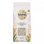 Six 500g Biona Organic Porridge Oats packets sit in a tidy row on a pale background. Each green-and-white packet displays the Biona logo, a bowl of porridge with oat illustration, organic certification symbols and nutrition text; glossy film catches reflected light. Shadows fall softly across the row.