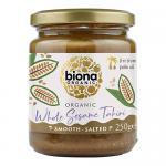 Six 250g glass jars of Biona Organic Whole Sesame Tahini - Salted sit neatly arranged in two rows of three. Each clear jar reveals creamy beige tahini under white lids and features a green-and-white Biona label with product name, photographed against a neutral light backdrop. Soft shadows fall around.