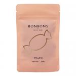 Bright peach-toned packet features bold OH MY GUM! logo in playful white typography across the front. Illustrated ripe peach halves and glossy round bonbons create a cheerful motif. The compact wrapped box shows a glossy finish, white accents and a small clear window revealing candies.