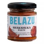 Six identical 130g jars of Belazu Shakshuka Paste sit in a neat row, their glass revealing deep red-orange paste. Labels display the Belazu logo and product name, accented by spice illustrations. Metal lids catch light, and the group casts soft shadows on a plain background. With soft studio lights.