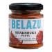 Six identical 130g jars of Belazu Shakshuka Paste sit in a neat row, their glass revealing deep red-orange paste. Labels display the Belazu logo and product name, accented by spice illustrations. Metal lids catch light, and the group casts soft shadows on a plain background. With soft studio lights.