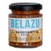 A photo shows six 130g Belazu Shawarma Paste jars neatly arranged in two rows. Clear glass reveals a glossy orange-red paste. Each jar carries a white label with the Belazu logo and product name, topped by a black screw lid that catches soft studio light Subtle shadows fall around the base now