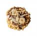 A glossy box labeled Di Santo & Family Bakery displays six Cestino Moderno hazelnut tarts visible through a clear window. Each tart shows a golden, flaky crust, glossy hazelnut filling and crushed nut topping, arranged in a neat tray against a pale background. Soft lighting casts gentle highlights..