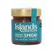 Six 200g jars of Islands Chocolate & Hazelnut Spread sit arranged in two rows on a neutral surface. Each clear jar reveals glossy brown spread, topped by dark lids and branded labels featuring hazelnut and cocoa imagery. Soft studio lighting creates gentle highlights and shadows.