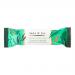 A rectangular 50g bar sits in a glossy bronze and cream wrapper labeled Jade & Joy Vegan Collagen with Salted Caramel text. A partly unwrapped bar shows a dense golden-brown interior streaked with caramel swirls and sprinkled with tiny salt crystals on a clean white background. Subtle embossed logo.