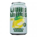 A dozen 330ml Living Things Lemon & Ginger cans sit in a clear shrink-wrapped tray, each bright yellow can displaying the Living Things logo alongside lemon slices and ginger root illustrations. The cans form a neat grid with subtle aluminum reflections against a white background. Soft studio lights.