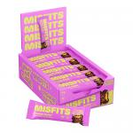 A matte wrapper in earthy brown and cream displays the Misfits logo and 'Plant Based Brownie Batter' text. A bar with fudgy brown interior and glossy chocolate drizzle sits partly unwrapped, crumbs scattered on a light surface, with small icons on the pack.