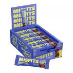 A rectangular 50g wrapper lies on a neutral surface, its branded design showing warm beige and chocolate-brown tones. Bold logo and product name appear front-center. An illustrated cookie dough scoop and scattered chocolate chips add texture. Nutrition icons and bar weight line the edge. With gloss.