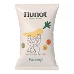 A bright bag of Nunat Parsnip Vegan Snack sits upright, cream-and-green packaging features a stylized parsnip illustration and bold Nunat logo. Nutritional icons and weight text appear; scattered golden parsnip crisps lie beside the bag on a light wooden surface soft natural light casts soft shadows