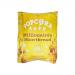 Photo shows a compact 24g Popcorn Shed Millionaire Shortbread snack pack with glossy caramel and shortbread imagery, warm golden-brown tones, clear brand logo and neat typography. Sixteen identical packs arrange in a grid, casting soft shadows on a neutral background. Edges crinkle subtly, revealing.