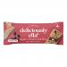 A rectangular carton of 16 individually wrapped 50g oat bars sits on a neutral surface. Packaging uses warm browns and reds, showing apple and raisin illustrations with cinnamon motifs. The brand logo appears bold; a cross-section reveals textured oats and fruit flecks. Shiny wrappers reflect light.