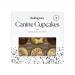 A bright cardboard tray displays nine cupcake-shaped dog treats, each topped with swirled ivory frosting and tiny sprinkle accents. Playful paw-print graphics and the Ruffingtons logo adorn vibrant packaging with a clear window revealing neatly arranged, bakery-style cupcakes Soft paper liners show