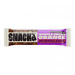 A rectangular SNACK’d Double Cacao & Orange box sits on a plain background. The wrapper features deep brown and bright orange colors, a photo of a broken oat bar showing cacao chunks and orange zest, with scattered oats and orange slices as accents.