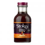 Six 315g glass bottles of Stokes Original BBQ Sauce stand together, showing thick reddish-brown sauce. Each bottle features a clean white label with the Stokes logo and product name, dark screw cap and minimalist branding; bottles sit on a plain, neutral background.