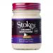 Six 220g glass jars of Stokes Creamed Horseradish Sauce are arranged in two neat rows; creamy off-white sauce fills each jar, visible through clear glass. Beige-and-red labels show bold Stokes branding and product name, while silver screw-top lids catch reflections. Subtle flecks and creamy texture.