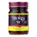 Six identical 250g glass jars of Stokes Chilli Jam sit in a neat group. Each jar shows deep red jam, a clean white label with brand lettering, and a dark screw-top lid. Light reflects off the glass, highlighting the textured chilli preserves inside A slim paper band wraps the lids with a red stripe