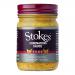 Six clear glass jars of Stokes Coronation Sauce sit grouped together. Pale orange, creamy sauce fills each jar beneath metal twist-off lids; white labels display the Stokes logo and product name with simple typography.