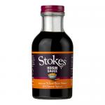 Image shows six 330g glass jars of Stokes Hoisin Sauce lined up. Each jar displays a glossy, deep-brown sauce through clear glass, a cream-and-red Stokes label, and reflective silver lids. Soft shadows and subtle highlights create depth on a plain, light background.