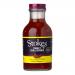 Six glass jars of Stokes Sweet Chilli Sauce sit in two neat rows. Bright red sauce fills clear bottles topped with dark lids. Labels feature the Stokes logo, product name and small chili illustrations. Light gleams on the glossy sauce and glass surfaces. Neutral backdrop and soft shadows frame them.