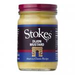 A cluster of six identical glass jars sits on a plain background. Each jar shows pale yellow Dijon mustard through clear glass, topped by a metal lid. Cream labels wrap the jars with the Stokes logo and product name, conveying simple, classic packaging.