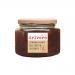 A clear glass jar of Drivers Caramelised Red Onion Chutney shows a glossy, deep mahogany spread with visible onion strands and specks of spice. A cream-and-red label wraps the jar, topped by a metal screw lid; the 350g size and brand logo appear on the front. Soft studio lighting catches glass sheen
