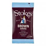 Photo shows a neat stack of 80 Stokes Real Brown Sauce 32g sachets. Each rectangular sachet features the Stokes logo, brown sauce imagery and white text on a red-accented label against a plain background.