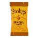 A neat stack of eighty 32g Stokes BBQ sauce sachets fills the frame. Each shiny packet shows the Stokes logo, dark-brown sauce swatch and clear BBQ labeling. Silver sealed edges catch light; uniform rows and slight reflections emphasize the compact, orderly bulk pack arrangement, neatly aligned set.